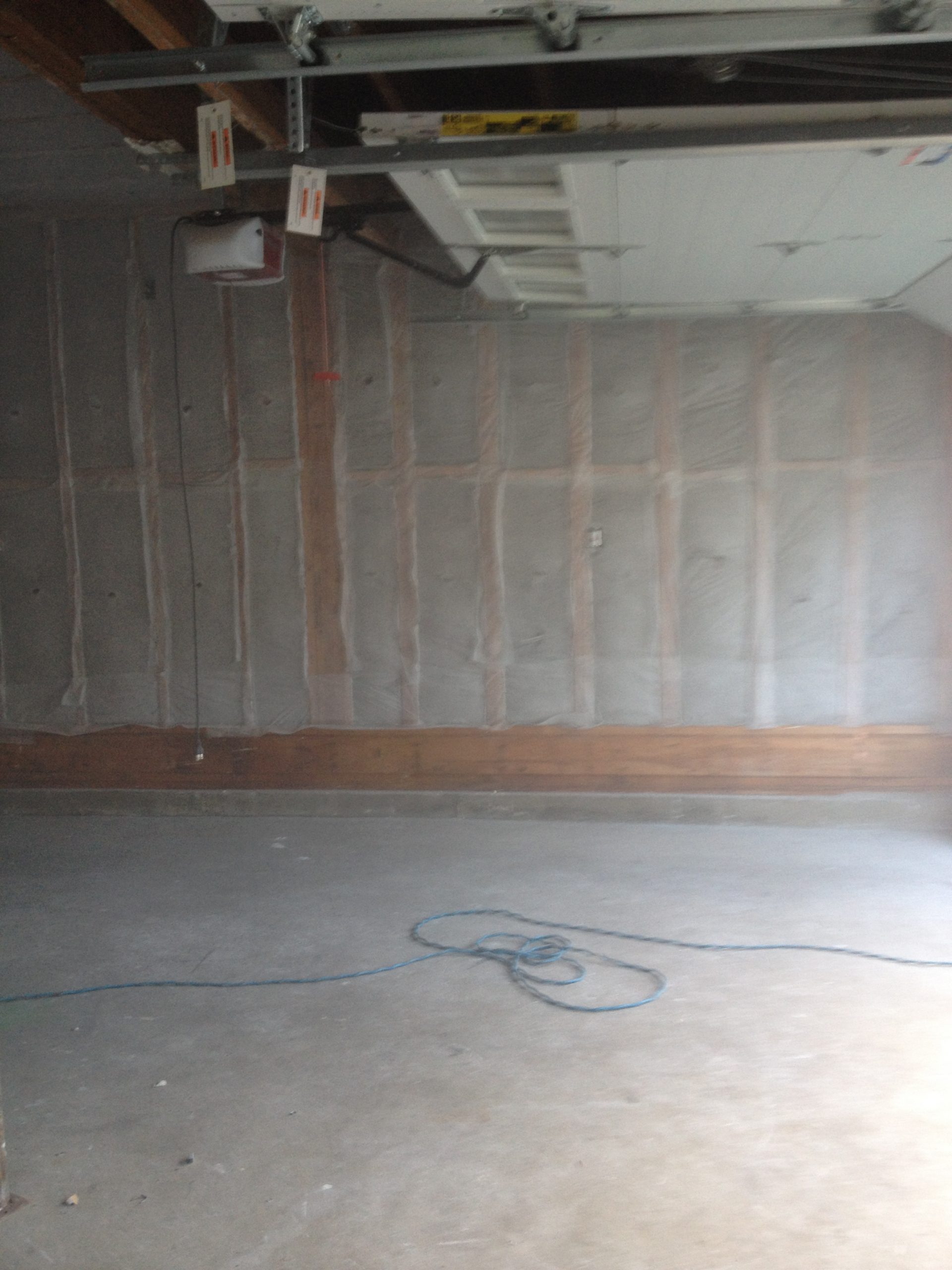 Dense-pack insulation installed in garage wall studs — NJ