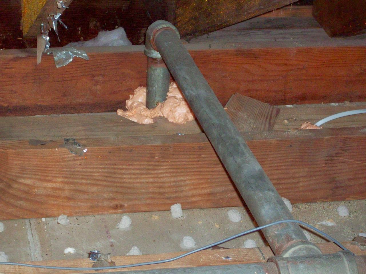 Air sealing around pipe penetration in attic floor — NJ home