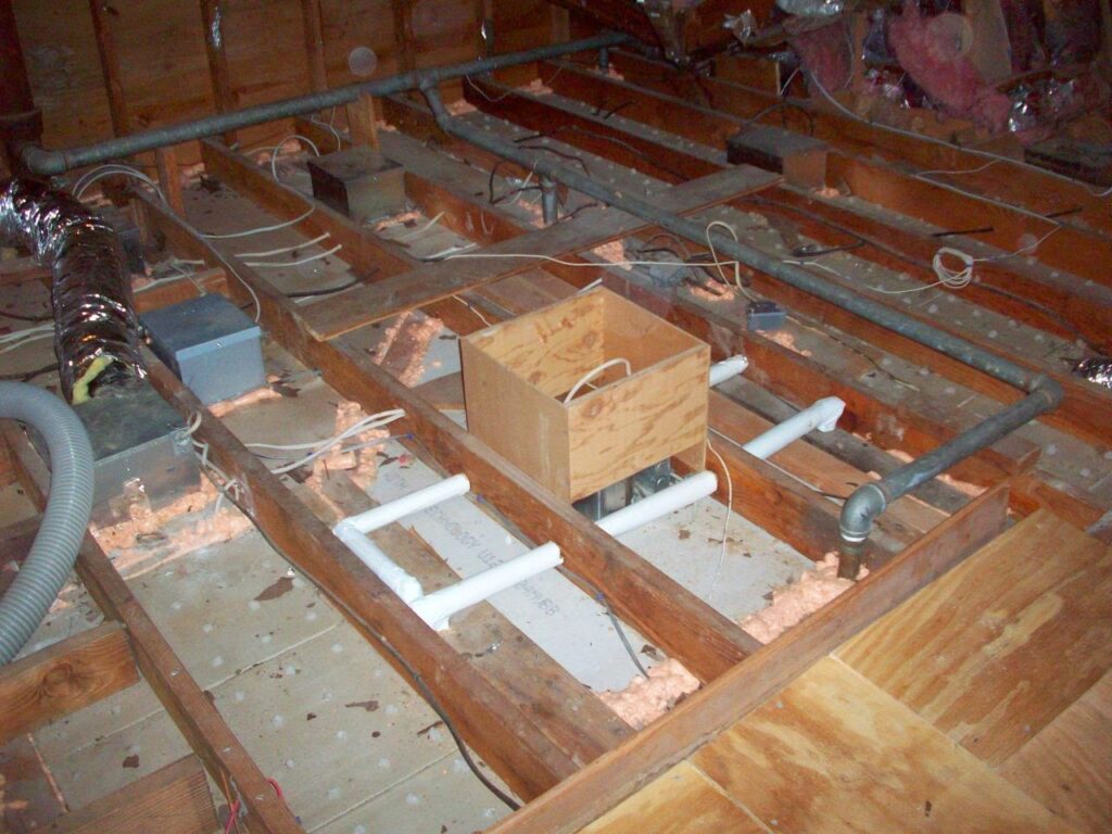Spray Foam Insulation Services 4 Attic top plates and wiring penetrations sealed with orange spray foam along the wall lines