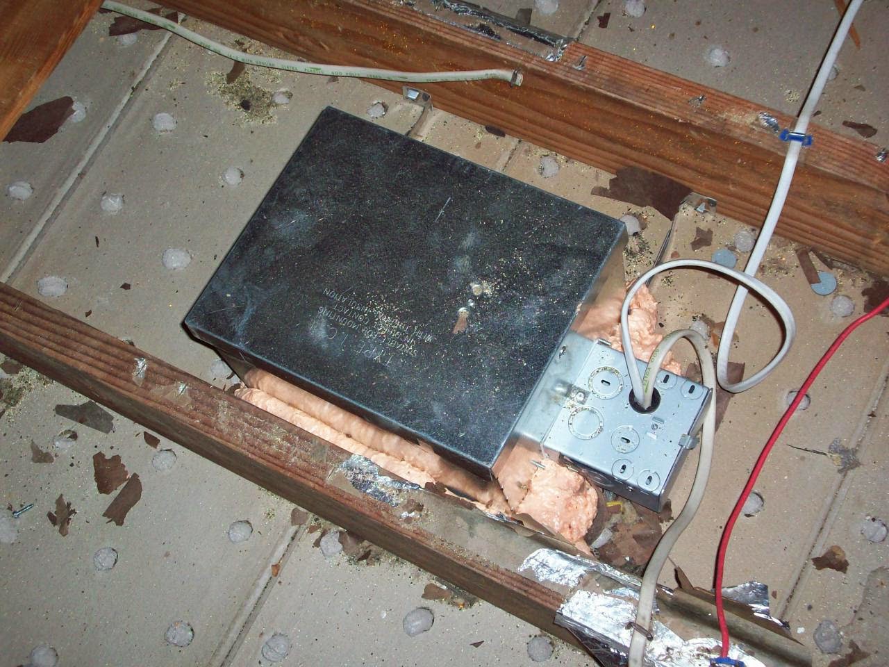 Attic air sealing in progress — Metro NY Insulation crew