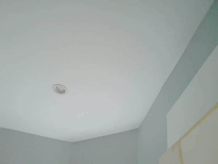 Infrared thermal image revealing air leakage and heat loss around a recessed ceiling light