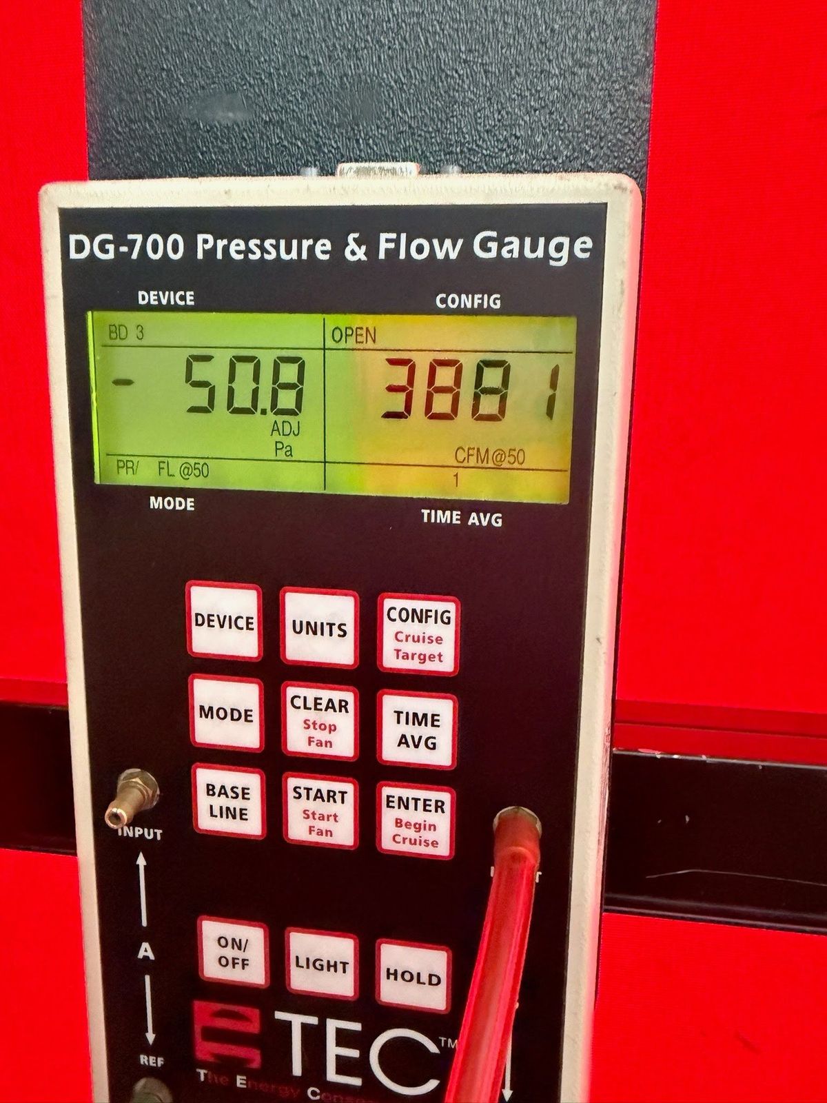 Exterior Dense Pack Cellulose Insulation Installation in White Plains, NY 5 Blower door test gauge measuring 3,881 CFM50 of air leakage before insulation work in White Plains NY