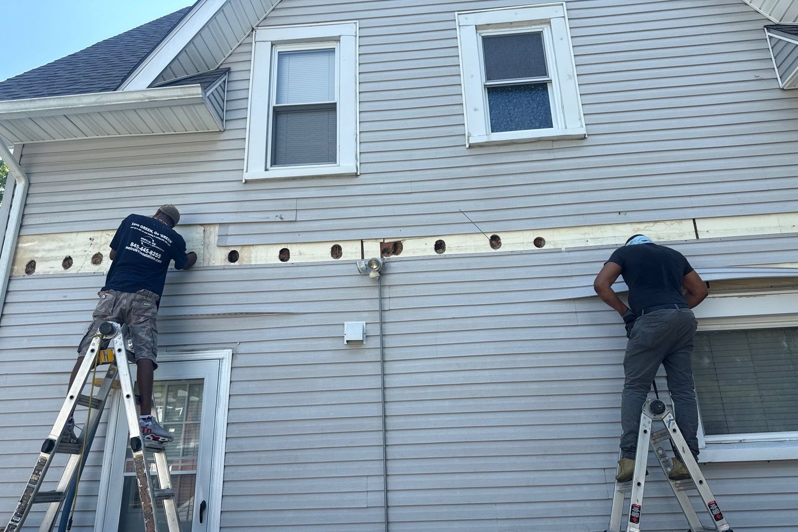 Exterior Dense Pack Cellulose Insulation Installation in White Plains, NY 3 Metro NY Insulation crew removing siding bands and dense-packing exterior wall cavities of an older White Plains NY home