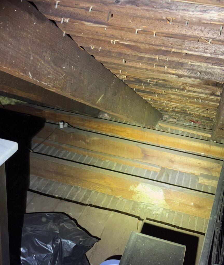 Ice Dams - Top Rated Insulation Services 2 Attic of an older Westchester home before insulation, bare joists and plank flooring with no air sealing
