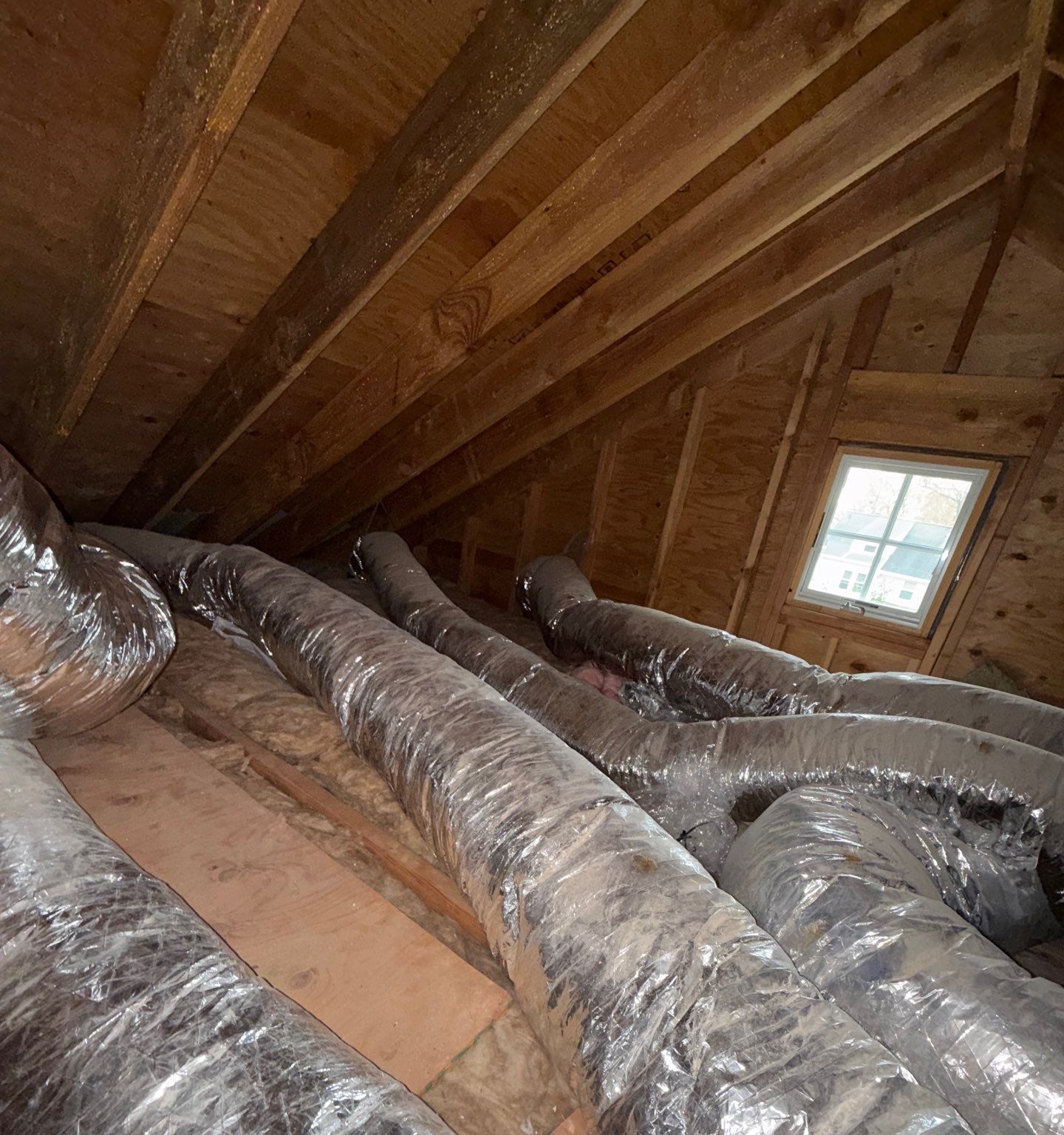 Spray Foam Attic and Crawl Space Insulation in Teaneck, NJ: Project Case Study 4 Attic in Teaneck NJ before spray foam: heating and cooling ducts in an unsealed attic