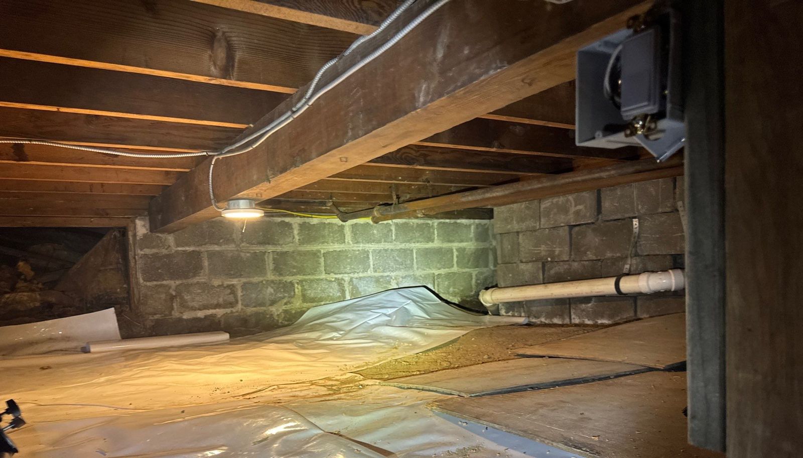 Attic, Wall and Crawl Space Insulation in Wappingers Falls, NY: Project Case Study 5 Crawl space before encapsulation in Wappingers Falls NY: open block walls and loose plastic